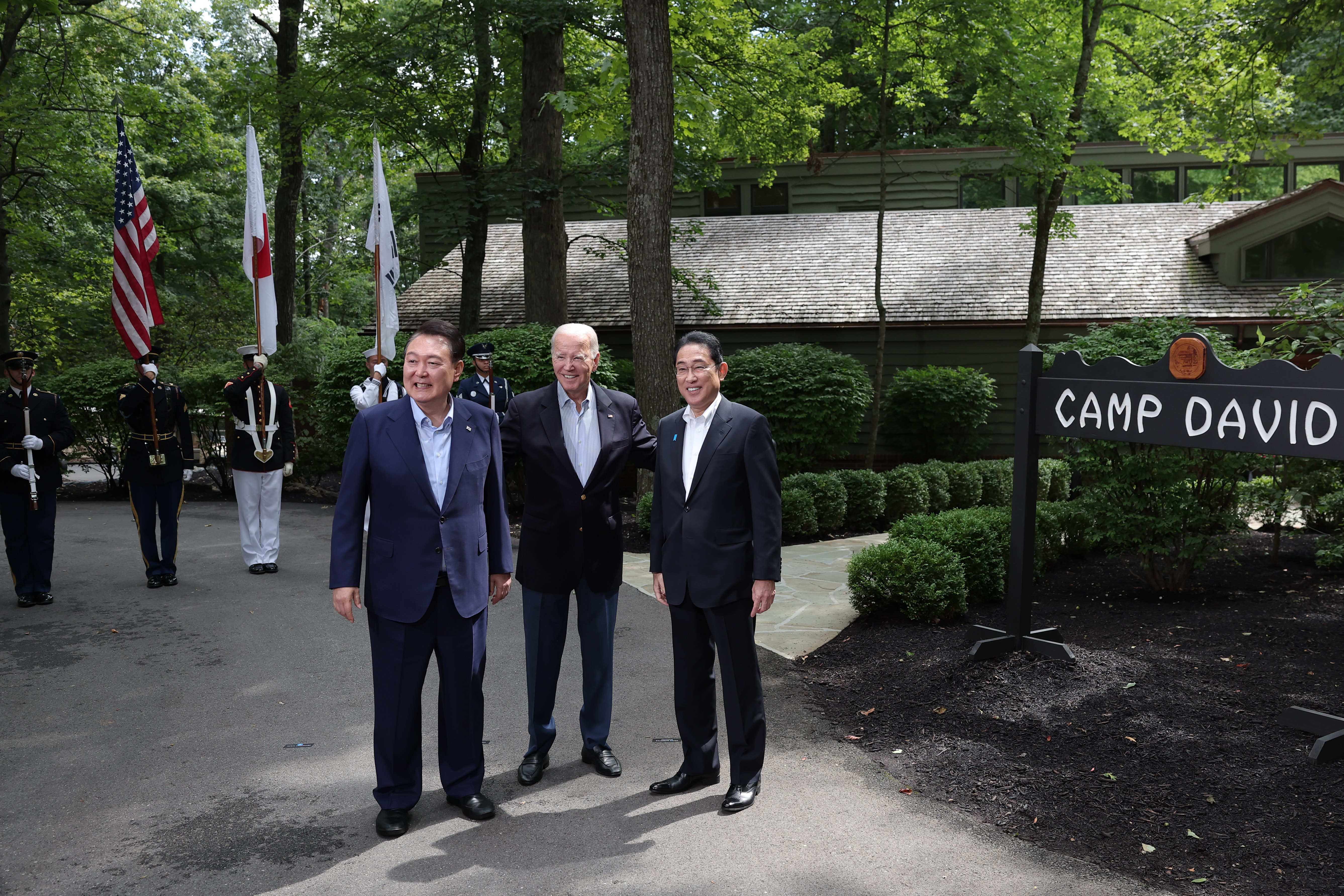 President Yoon (left) on Aug. 18, 2023, at the U.S. presidential retreat of Camp David, Maryland, poses for a photo with U.S. President Joe Biden and Japanese Prime Minister Fumio Kishida ahead of the inaugural trilateral summit among their three countries. The leaders agreed to hold such talks regularly and set up a real-time system to share information on North Korea's missiles. 