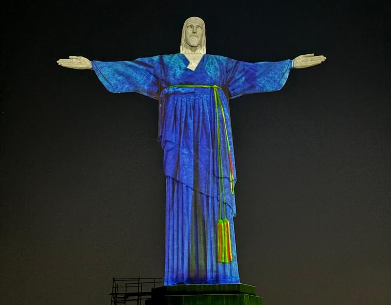 The iconic statute Christ the Redeemer in Rio de Janeiro, Brazil, has projected on it a digital image of the traditional clothing Hanbok. (Korean Cultural Center in Sao Paolo) 