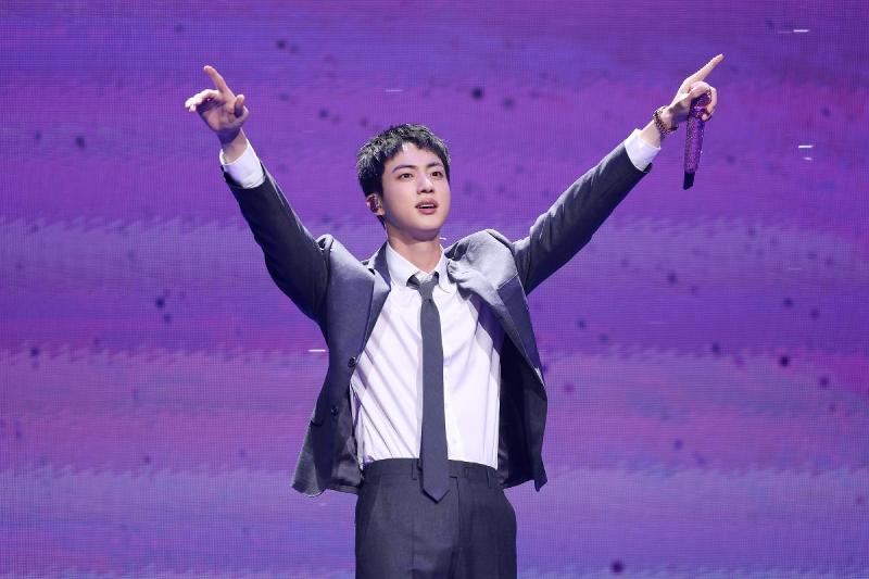 Jin of BTS on June 13 greets fans at Jamsil Arena in Seoul's Songpa-gu District, after finishing his mandatory military service the day before at the Republic of Korea Army 5th Infantry Division Recruit Training Center in Yeoncheon-gun County, Gyeonggi-do Province. (Big Hit Music)