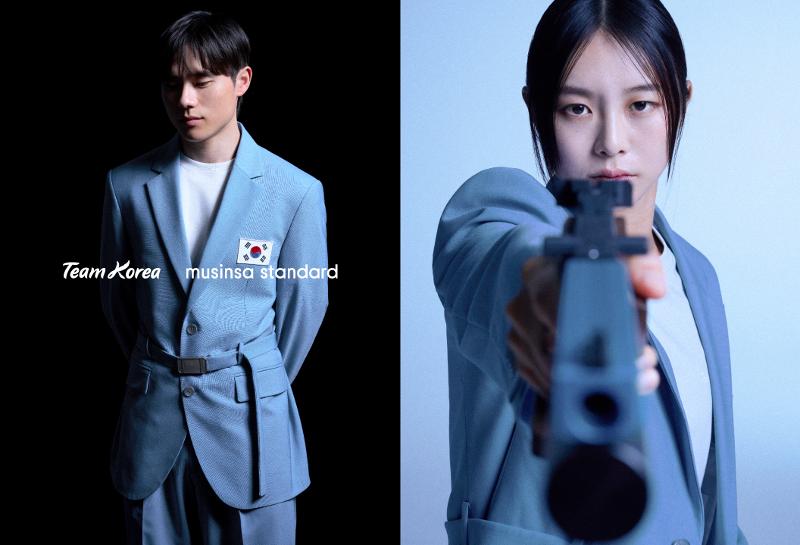 Artistic gymnast Kim Hansol (left) and pentathlete Kim Sunwoo wear the national team uniforms made by the domestic fashion brand Musinsa Standard to be worn at the opening and closing ceremonies of this year's Paris Summer Olympics.(Musinsa Standard) 