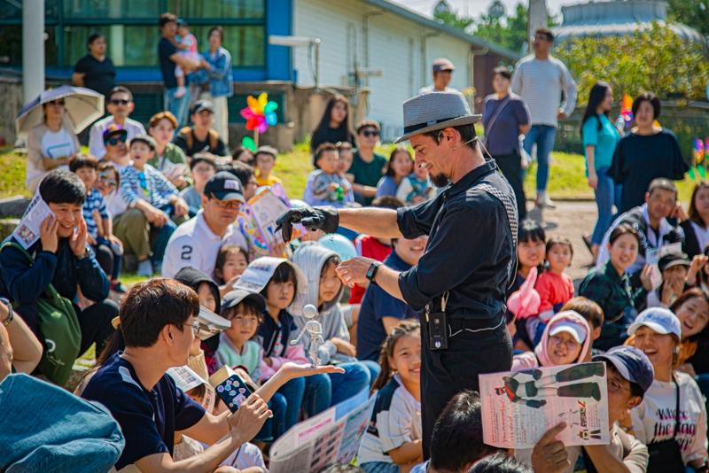 A puppeteer master performs with the audience at an outdoor program of the Chuncheon Puppet Festival in Chuncheon, Gangwon-do Province.  