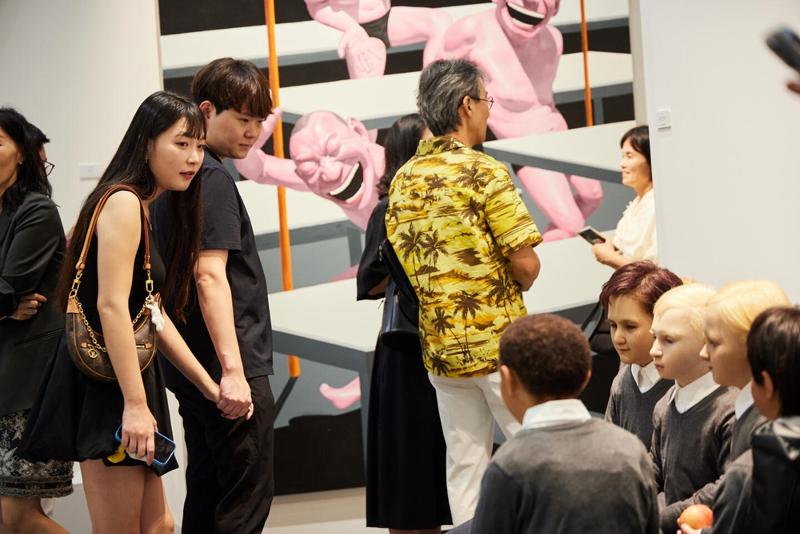 Tang Contemporary Art's booth in the background has a painting by Yue Minjun and an installation work by Li Wei. (Frieze Seoul)