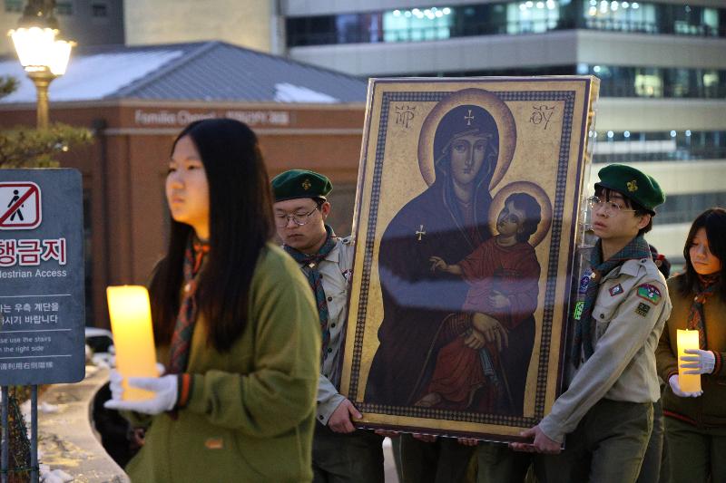 Youths on Nov. 29 carry the icon of 