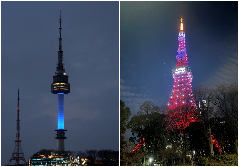 N Seoul Tower (left) on Feb. 15 lights up in blue and red in colors of the national flags of Korea and Japan. Tokyo Tower on the same day is illuminated with the phrase 