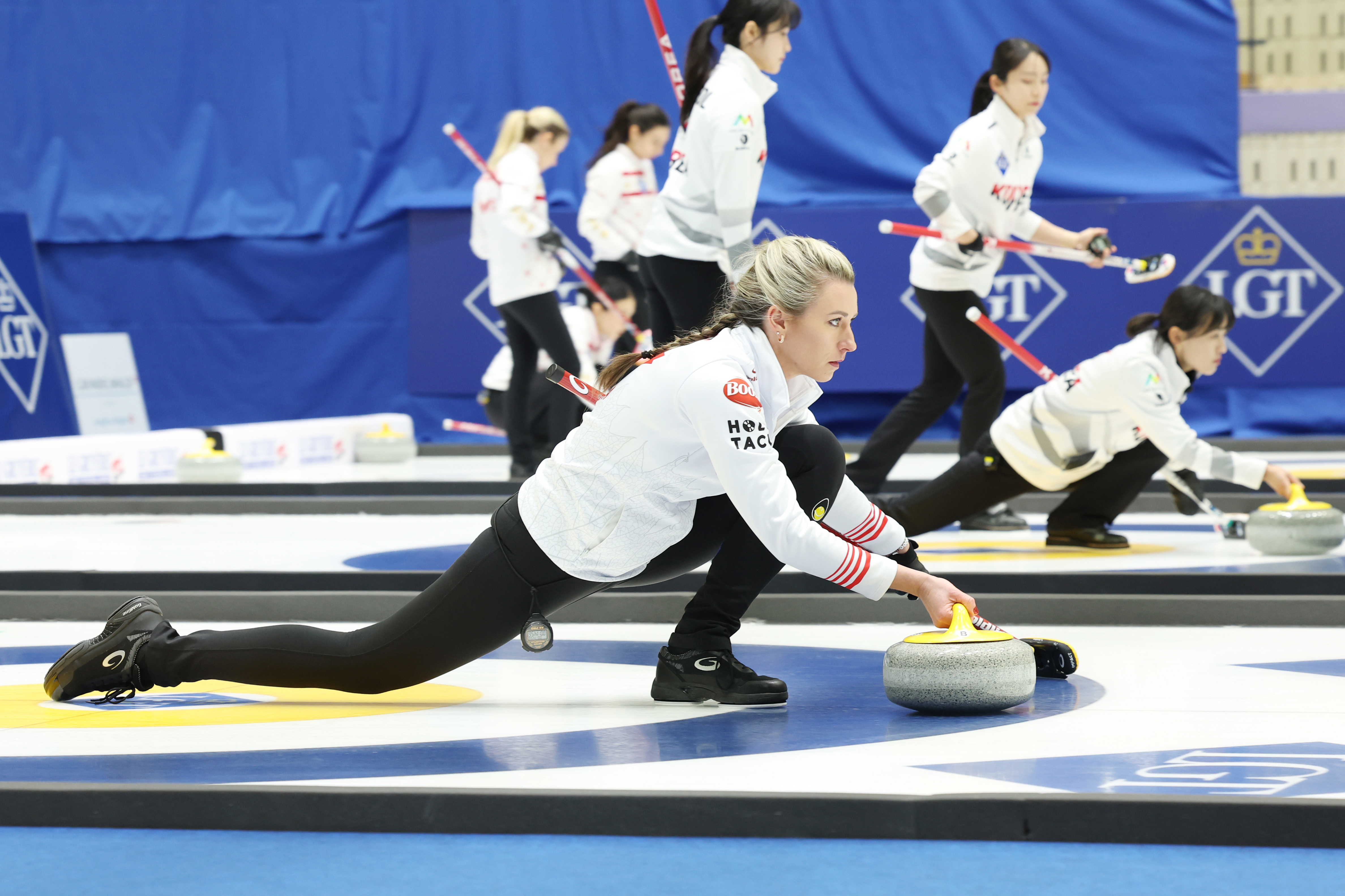 Emma Miskew of Canada on March 15 pitches a stone in a match against Lithuania at Uijeongbu Indoor Ice Rink in Uijeongbu, Gyeonggi-do Province, on the opening day of the LGT World Women's Curling Championship.