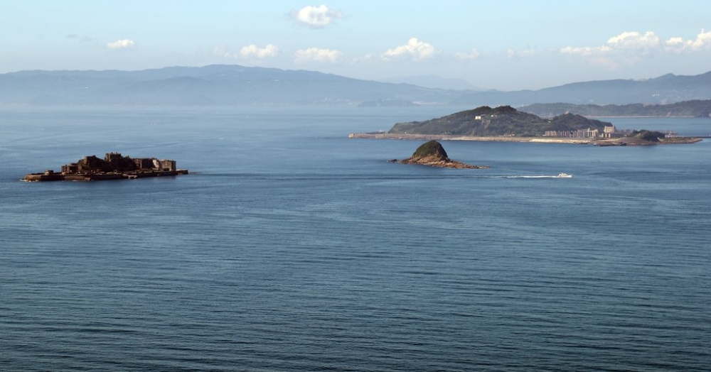 This photo taken on June 30 shows the Japanese islands of Hashima (left) and Takashima (larger island on right), two sites where Koreans were forced to work before and during World War II, as seen from an observatory in Japan's Nagasaki Prefecture. (Yonhap News)