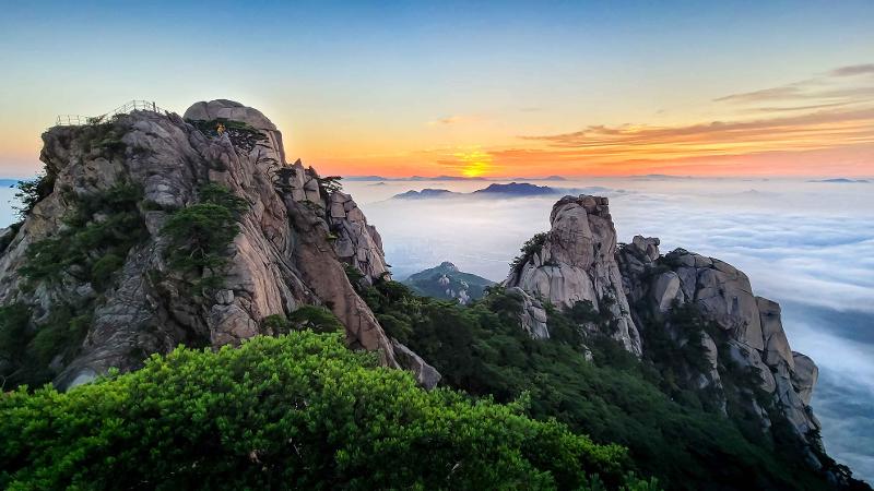 The landscape of Dobongsan Mountain (740 m tall) stretches across Dobong-gu District of Seoul, Uijeongbu and the township of Jangheung-myeon in Yangju, Gyeonggi-do Province. 