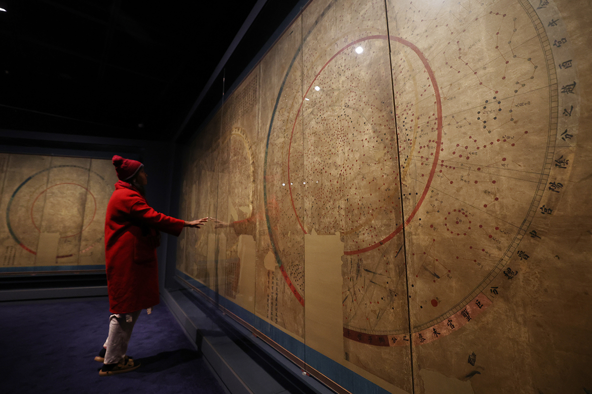 A visitor on Oct. 29 looks at two astronomical charts from the Joseon Dynasty (1392-1910) at the exhibition 