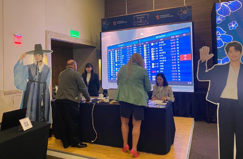 Visitors get information from a booth at the K-Travel Mart, which ran from Nov. 10-11 at the hotel Presidente InterContinental in Mexico City.  