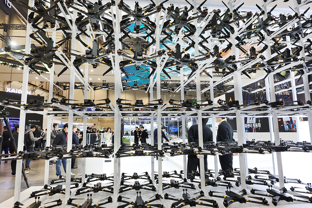 Visitors on Feb. 27 look at drones for military training at DSK (Drone Show Korea) 2026 at Hall 1 of BEXCO (Busan Exhibition and Convention Center) in Busan
