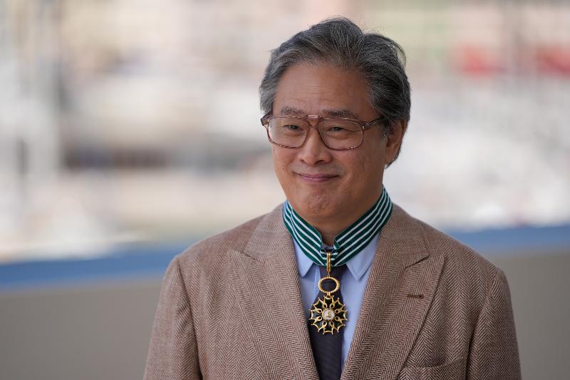 Director Park Chan-wook on May 17 poses for a photo after receiving the French government's highest cultural honor, Commander of the Order of Arts and Letters, at the Palais des Festivals et des Congres in Cannes, France, the site of this year's Cannes Film Festival. 