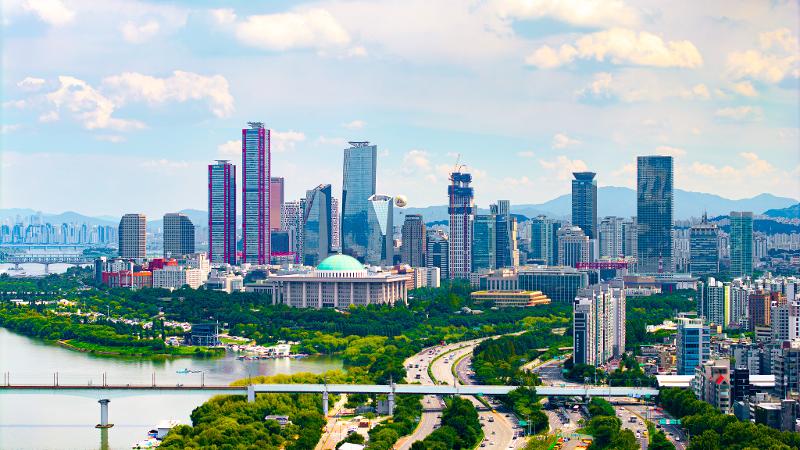 The Organisation for Economic Co-operation and Development has raised its 2026 growth forecast for Korea to 2.6%, up from 1.7% in March. Shown is the financial area of Yeouido in Seoul. (Seoul Tourism Organization)  