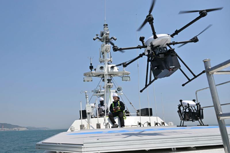A vertical takeoff and landing drone for reconnaissance and surveillance on May 12, 2025, takes off during a naval exercise for the operational feasibility of commercial unmanned systems in peacetime in waters near Ilsan Port of Ulsan's Dong-gu District. (Republic of Korea Navy)