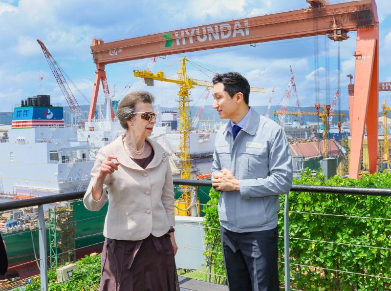 Princess Anne of Britain (left) on July 14 talks to Chung Kisun, chairman of the conglomerate HD Hyundai, at the shipyard of HD Hyundai Heavy Industries in Ulsan. (HD Hyundai Heavy Industries)  